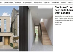 Exterior view of Frame House, a contemporary new build in South West London designed by Studio AVC, featuring a creamy brick facade, large glass elements, and an angled design to maximize natural light and views.