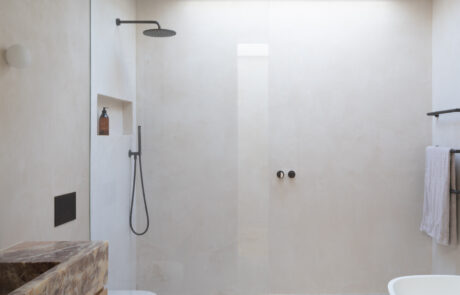 Bathroom with skylight providing natural light, modern design, and neutral tones.