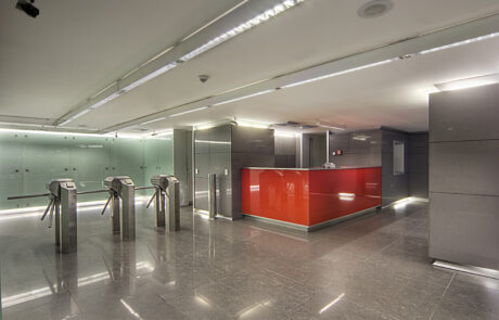 Bank entrance hall with modern design, high ceilings, sleek flooring, and minimalist decor.